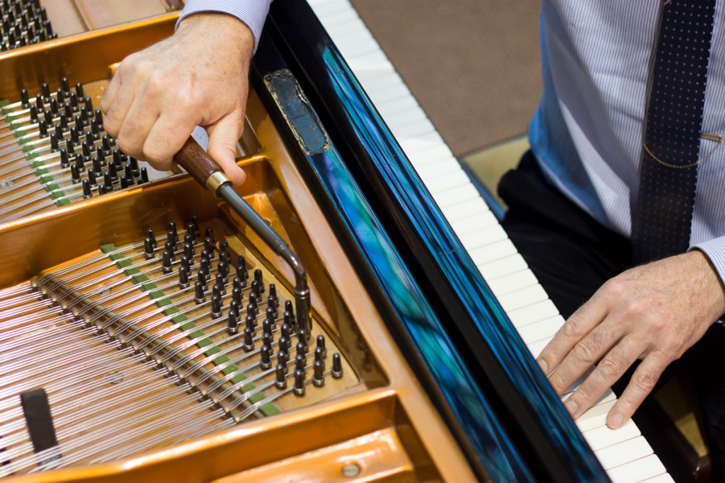 Piano being tuned