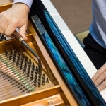 Piano being tuned